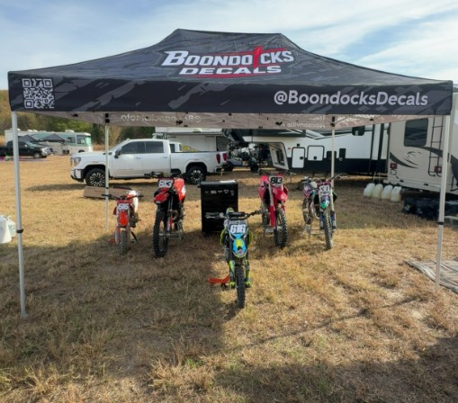 Custom motocross graphics on a dirt bike at Boondocks Moto
